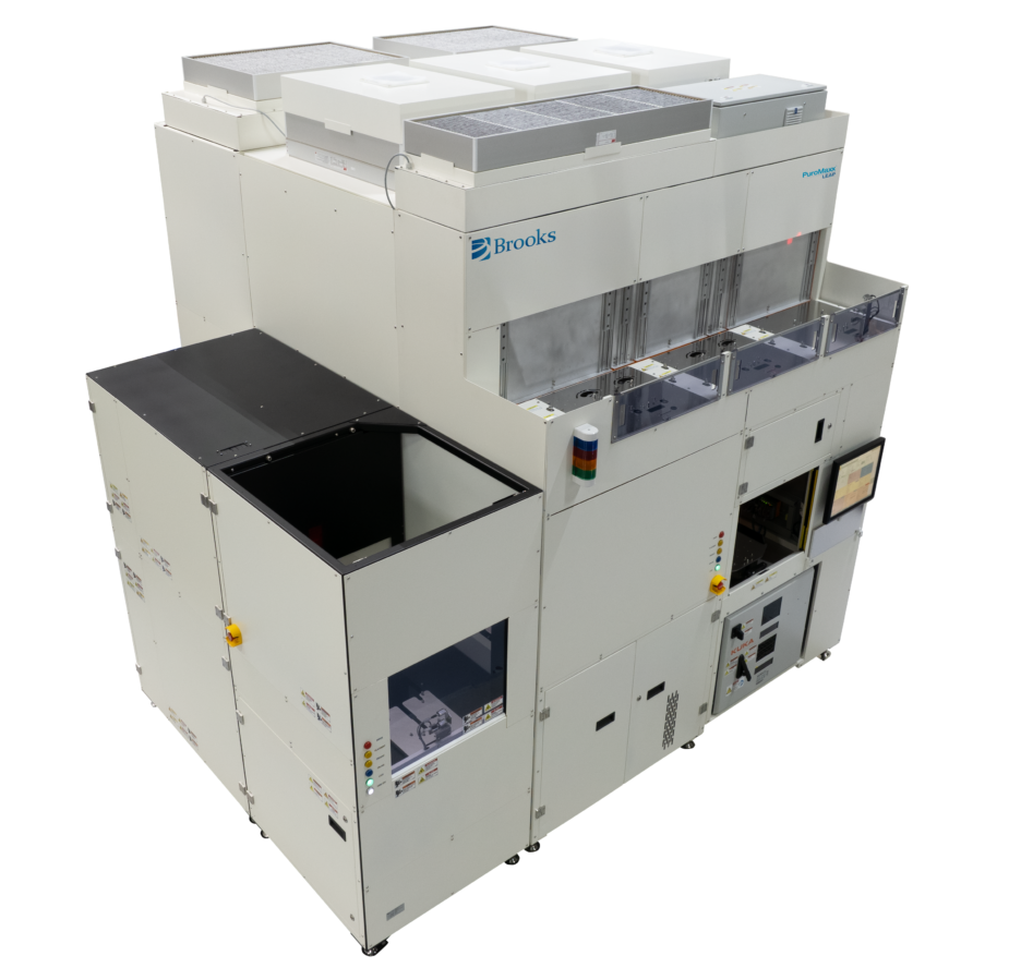 Large industrial semiconductor processing machine with control panel, multiple compartments, vents on top, and the Brooks logo visible on the upper section.